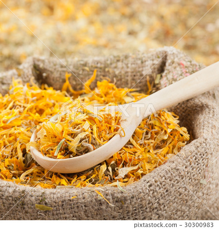 sack of healing herbs and wooden scoop sack of healing herbs and wooden scoop 30300983