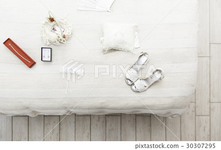 Shoes and earrings for a wedding 30307295