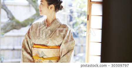 A woman enjoying a tea ceremony A woman enjoying a tea ceremony 30309797
