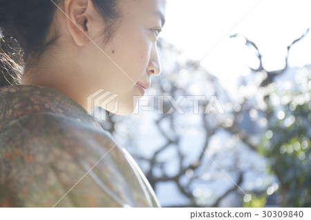 A woman enjoying a tea ceremony A woman enjoying a tea ceremony 30309840