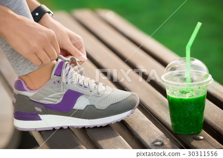 Young woman lace up snickers healthy sporty Young woman lace up snickers healthy sporty 30311556