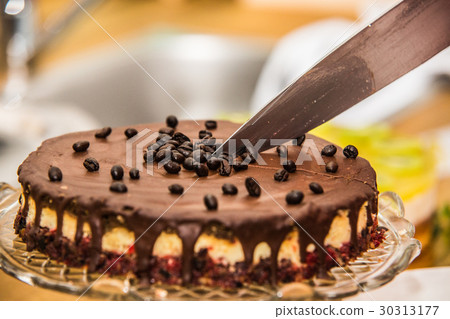 Delicious sweet baked cake with coffee beans Delicious sweet baked cake with coffee beans 30313177