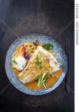 Thai Curry with Halibut Filet on Plate 30314519