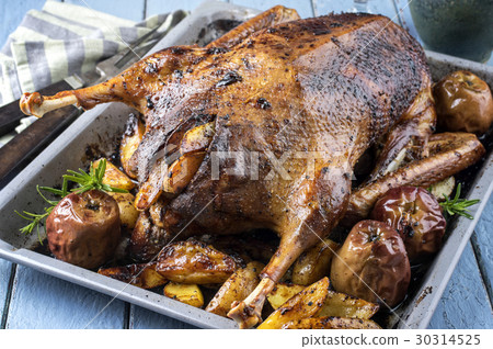 Roast Goose with Potatoes, Apple and Quince Roast Goose with Potatoes, Apple and Quince 30314525