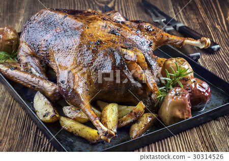 Roast Goose with Potatoes, Apple and Quince Roast Goose with Potatoes, Apple and Quince 30314526