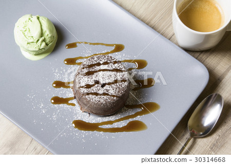 Chocolate fondant lava cake with caramel topping 30314668