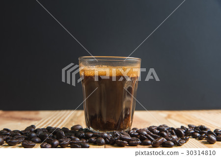 espresso in a glass on wooden table 30314810