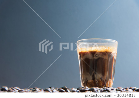 espresso in a glass on wooden table 30314815