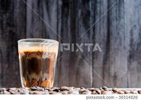 espresso in a glass on wooden table espresso in a glass on wooden table 30314820