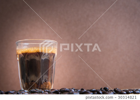 espresso in a glass on wooden table espresso in a glass on wooden table 30314821