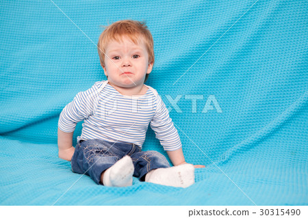Little kid at home on the couch 30315490