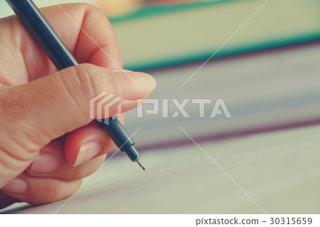hand with pen 30315659