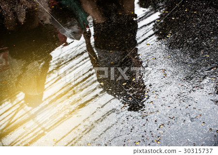 Puddle of water in rain - selective focus 30315737