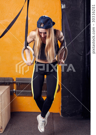 Fitness woman doing workout in a gym 30316281