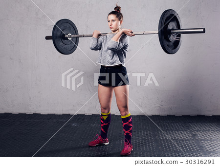 Fitness woman doing workout in a gym 30316291