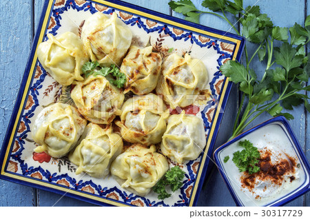 Pelmeni with Yoghurt on Plate 30317729