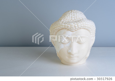 Buddha face. Buddha statue made of white marble 30317926