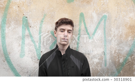 portrait of a young man in front a sprayed heart 30318901