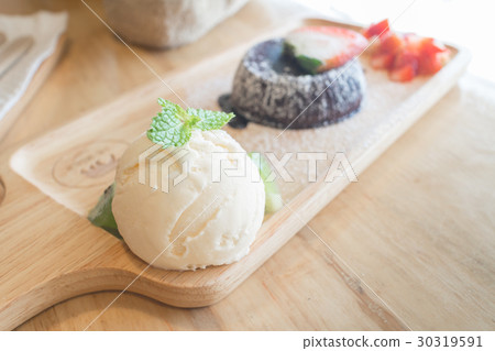 chocolate lava cake with vanilla ice cream, fruit 30319591