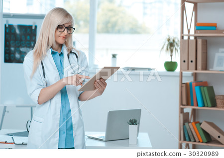 Young woman doctor occupation in the hospital Young woman doctor occupation in the hospital 30320989