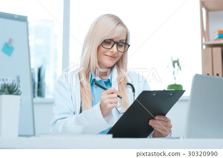 Young woman doctor occupation in the hospital Young woman doctor occupation in the hospital 30320990
