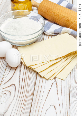 dried uncooked lasagna pasta sheets and dried uncooked lasagna pasta sheets and 30321174