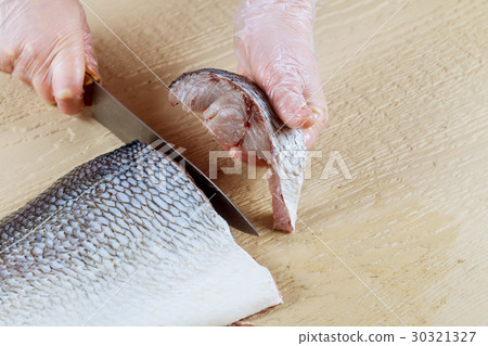 A master chef cutting for fillets A master chef cutting for fillets 30321327