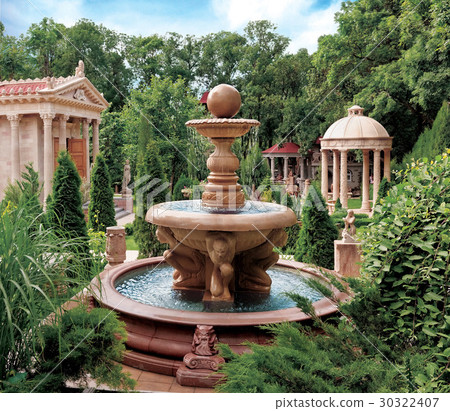 Water fountain in old park. 30322407