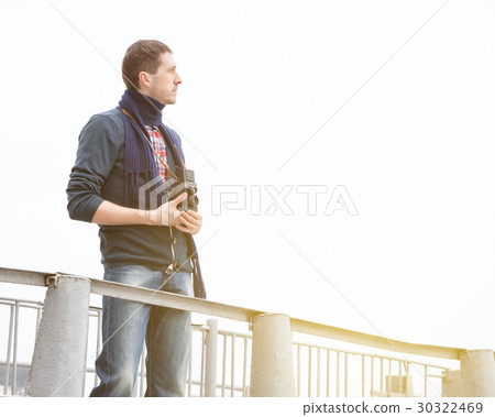 young man with vintage camera young man with vintage camera 30322469