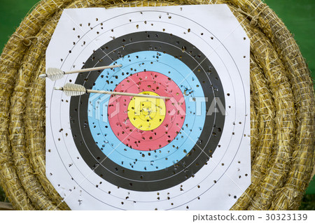 Archery Target With Arrows On a straw background Archery Target With Arrows On a straw background 30323139