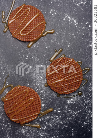 Stroopwafels with caramel sauce 30323583