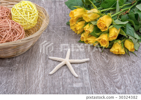 White starfishes and roses on a wooden background 30324382