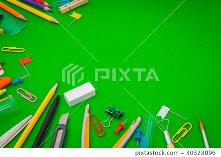School supplies on Green chalkboard " Back to school background " . 30328096