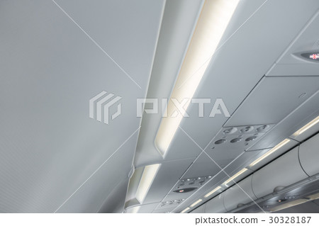 Signs panel above the seat on plane . 30328187