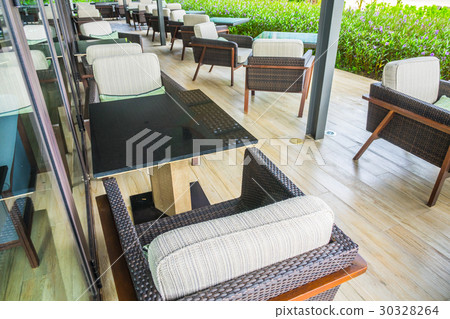 Tables and chairs in restaurant . 30328264