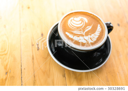 Latte Coffee art on the wooden table . Latte Coffee art on the wooden table . 30328691