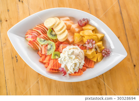 Fresh fruits ice cream on wood table . 30328694