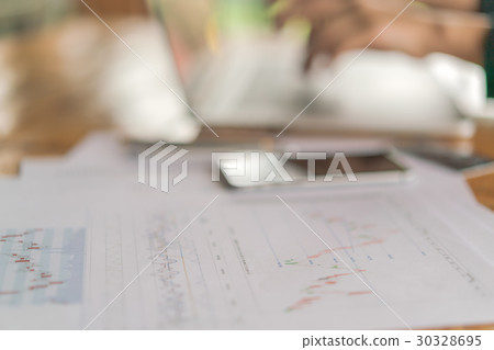 Business woman hand with Financial charts and laptop on the table . Business woman hand with Financial charts and laptop on the table . 30328695