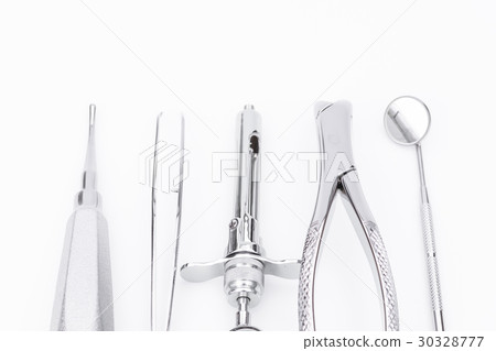 Dental tools and equipment on white background Dental tools and equipment on white background 30328777