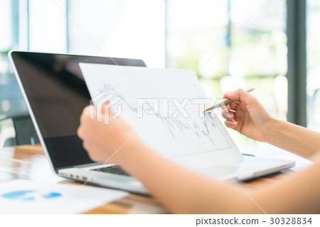Business people using laptop and Financial charts at meeting office . 30328834