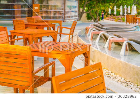 Table and chairs at restaurant in tropical Maldives island . Table and chairs at restaurant in tropical Maldives island . 30328962