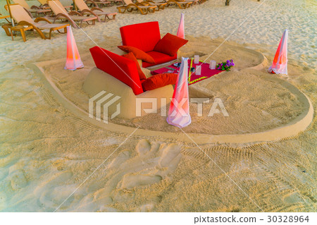 Dining table on beach at tropical Maldives island Dining table on beach at tropical Maldives island 30328964