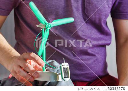 man with solar panel windmill man with solar panel windmill 30332278