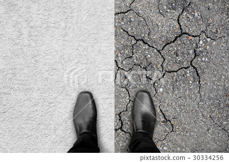 Black shoes standing on carpet and earth 30334256