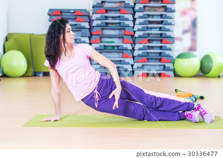 Fit woman doing plank core exercise training back Fit woman doing plank core exercise training back 30336477