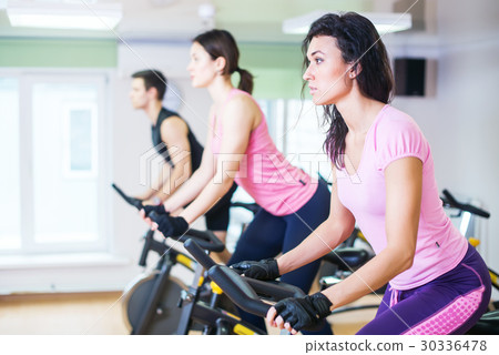 Group training people biking in the gym 30336478