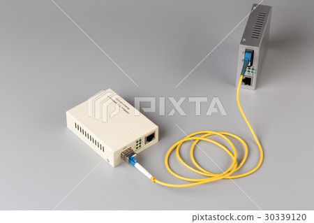 Two media converters connected by fiber cable Two media converters connected by fiber cable 30339120