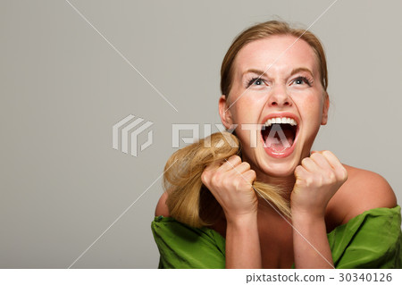 Screaming girl in green dress Screaming girl in green dress 30340126