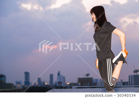 female in sports clothing make body stretching 30340334