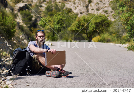 Hitch-hiking traveler Hitch-hiking traveler 30344747